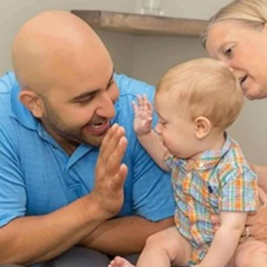 Chiropractor in Maryville TN Dr. Vic Manzo consulting with a child and mother at The Wellness Path