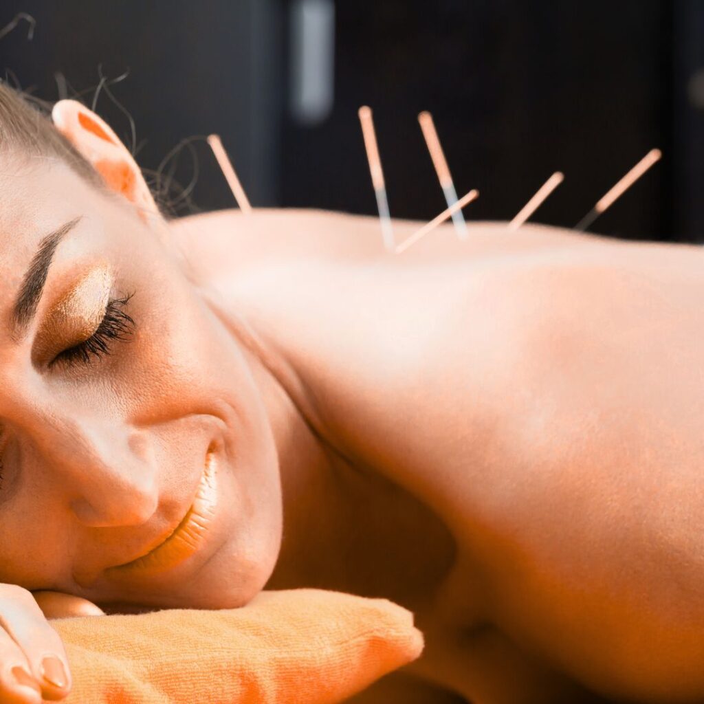 Dr. Vic Manzo performing dry needling treatment on a patient at The Wellness Path in Knoxville, TN — serving Knoxville, Morristown, and Maryville