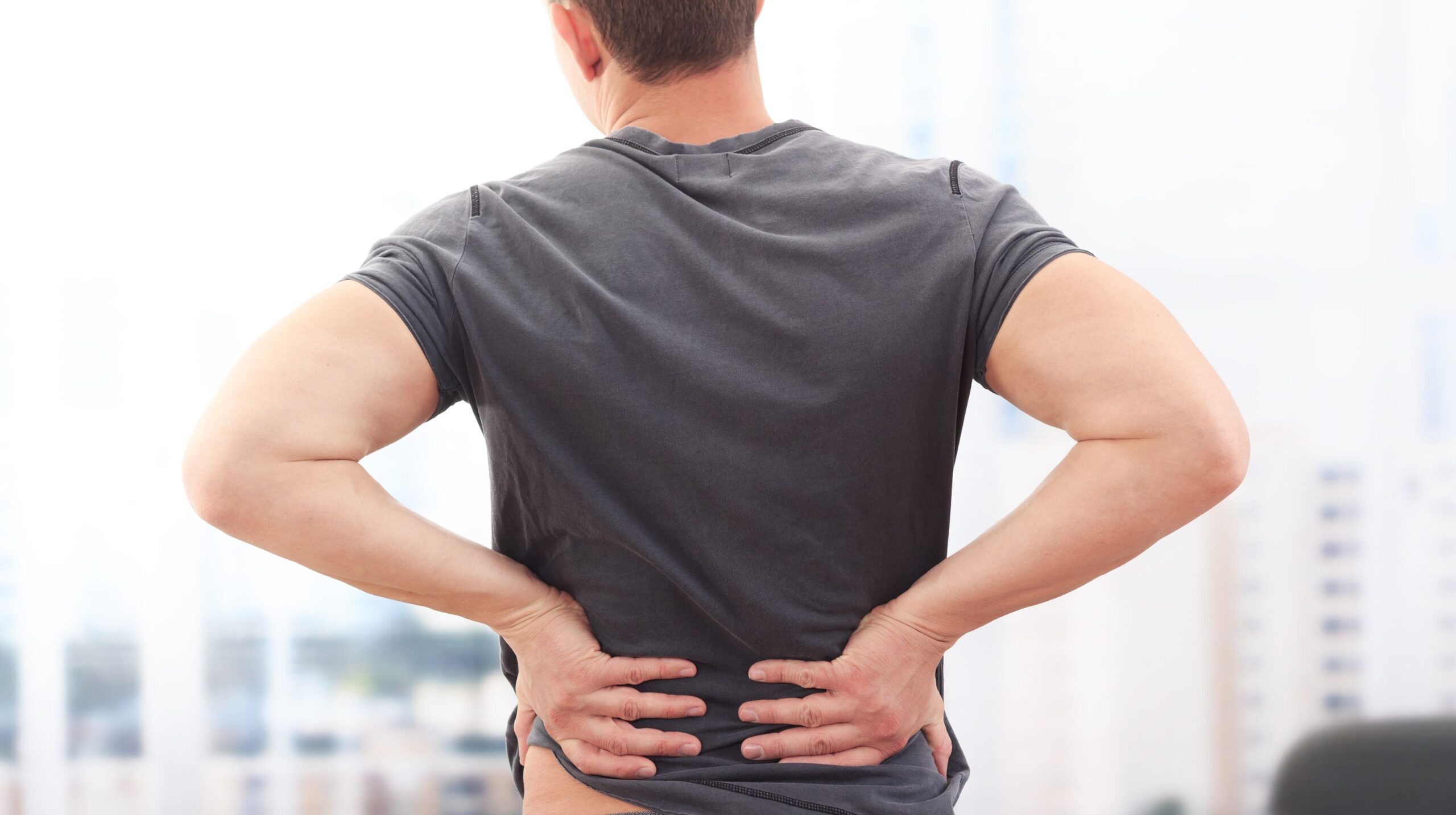 Person receiving chiropractic care for lower back pain at The Wellness Path in Knoxville TN