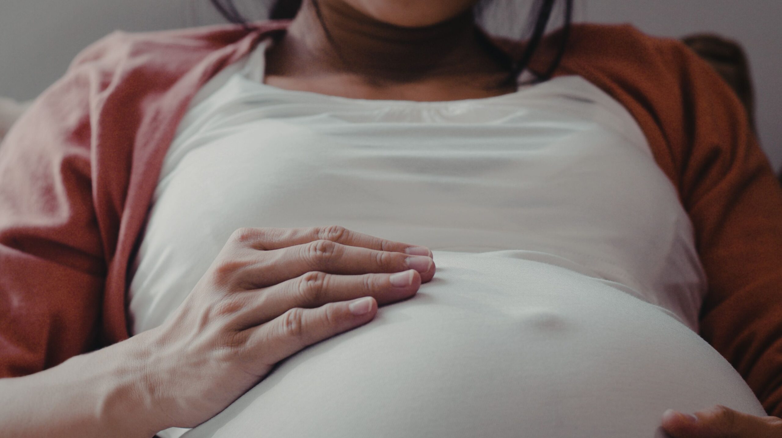 Pregnant woman receiving Webster Technique chiropractic care for breech baby positioning at The Wellness Path in Knoxville TN