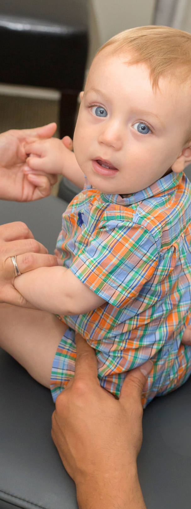 Chiropractor in Knoxville TN Dr. Vic Manzo palpating an infant at The Wellness Path