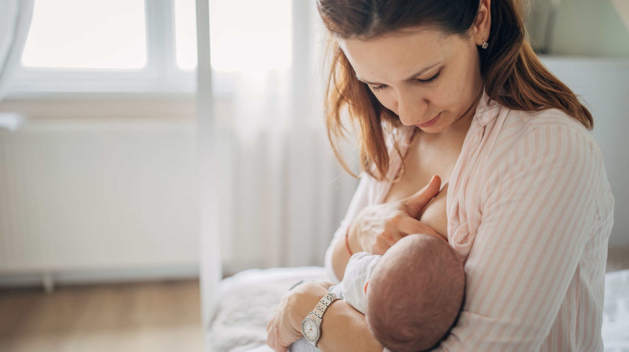 Infant and mother receiving support for latching difficulties at The Wellness Path in Knoxville TN