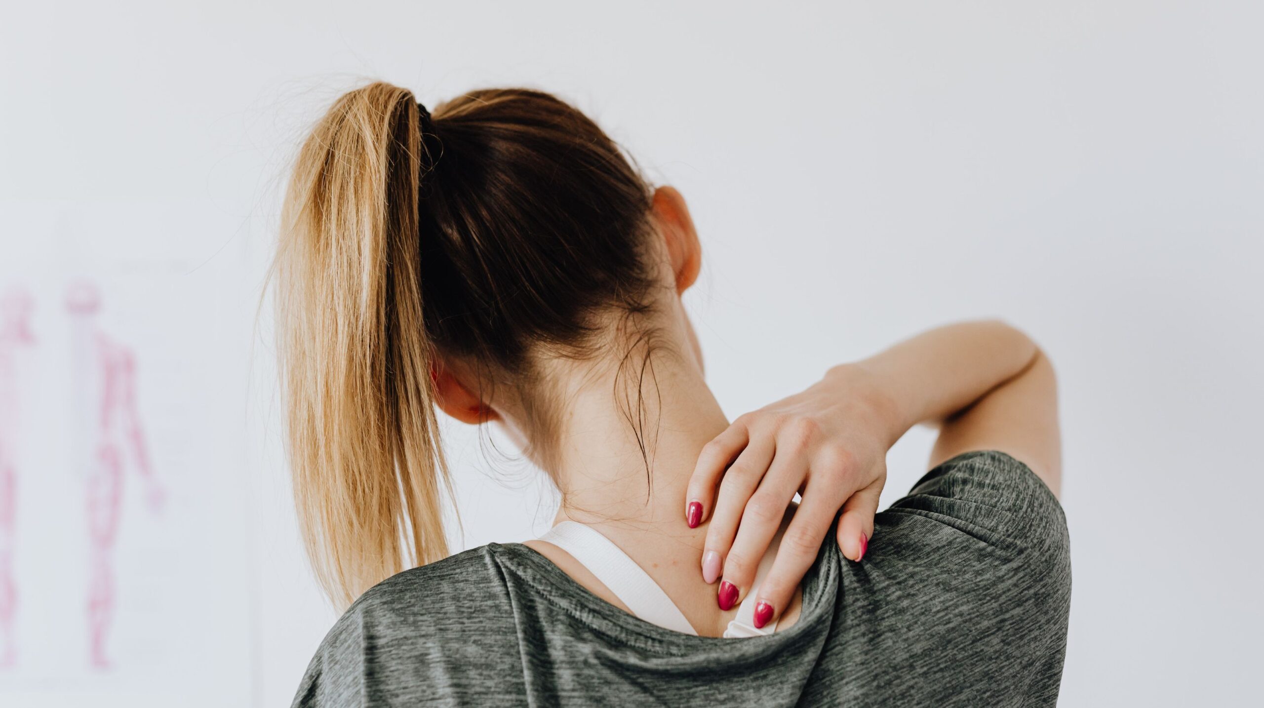 Person receiving chiropractic care for mid back pain at The Wellness Path in Knoxville TN