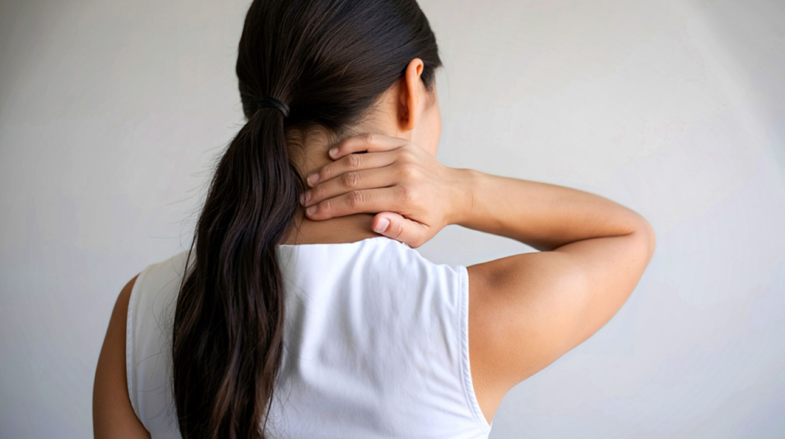 Person receiving chiropractic care for neck pain at The Wellness Path in Knoxville TN
