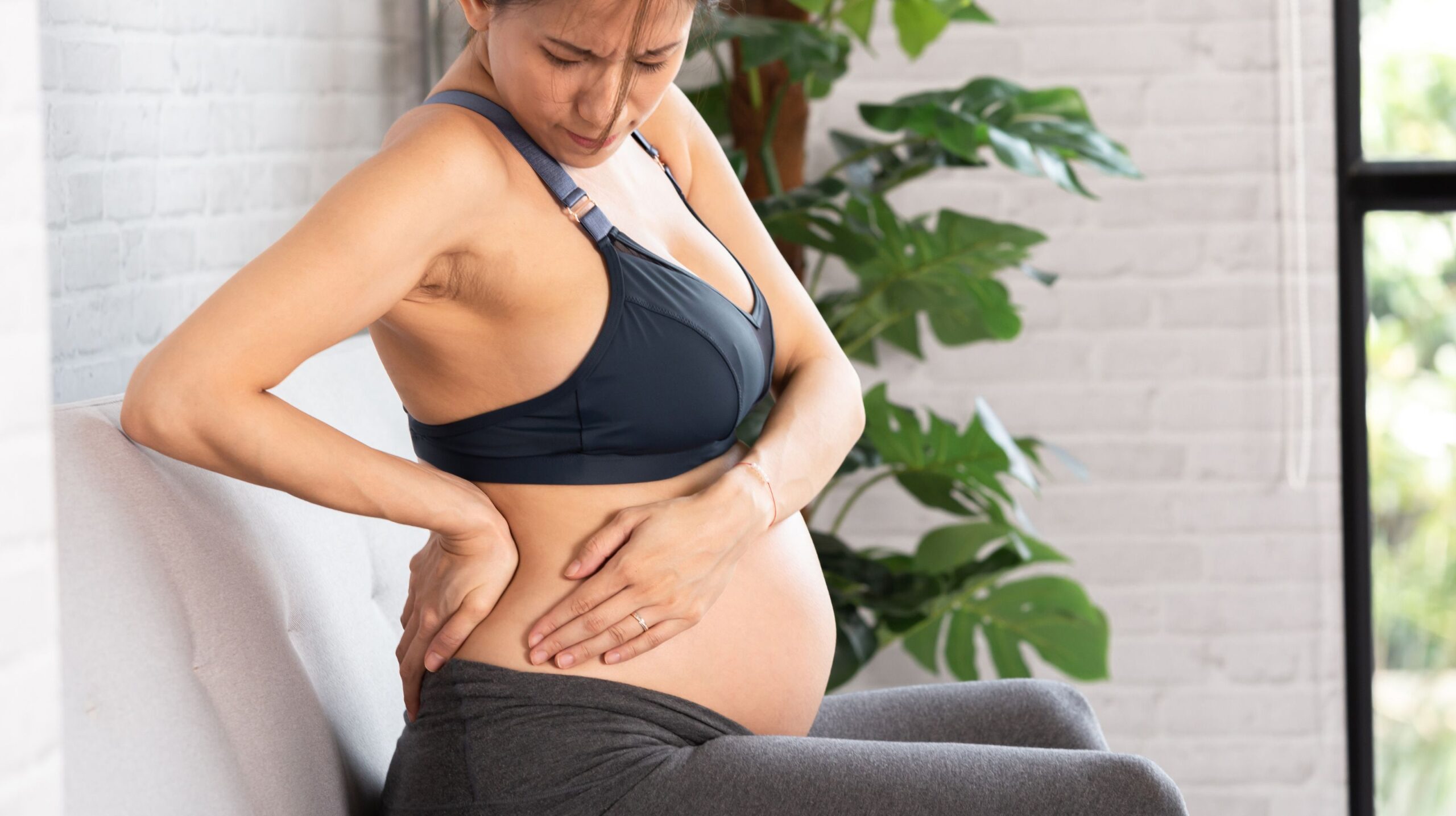 Pregnant woman receiving chiropractic care for rib pain at The Wellness Path in Knoxville TN