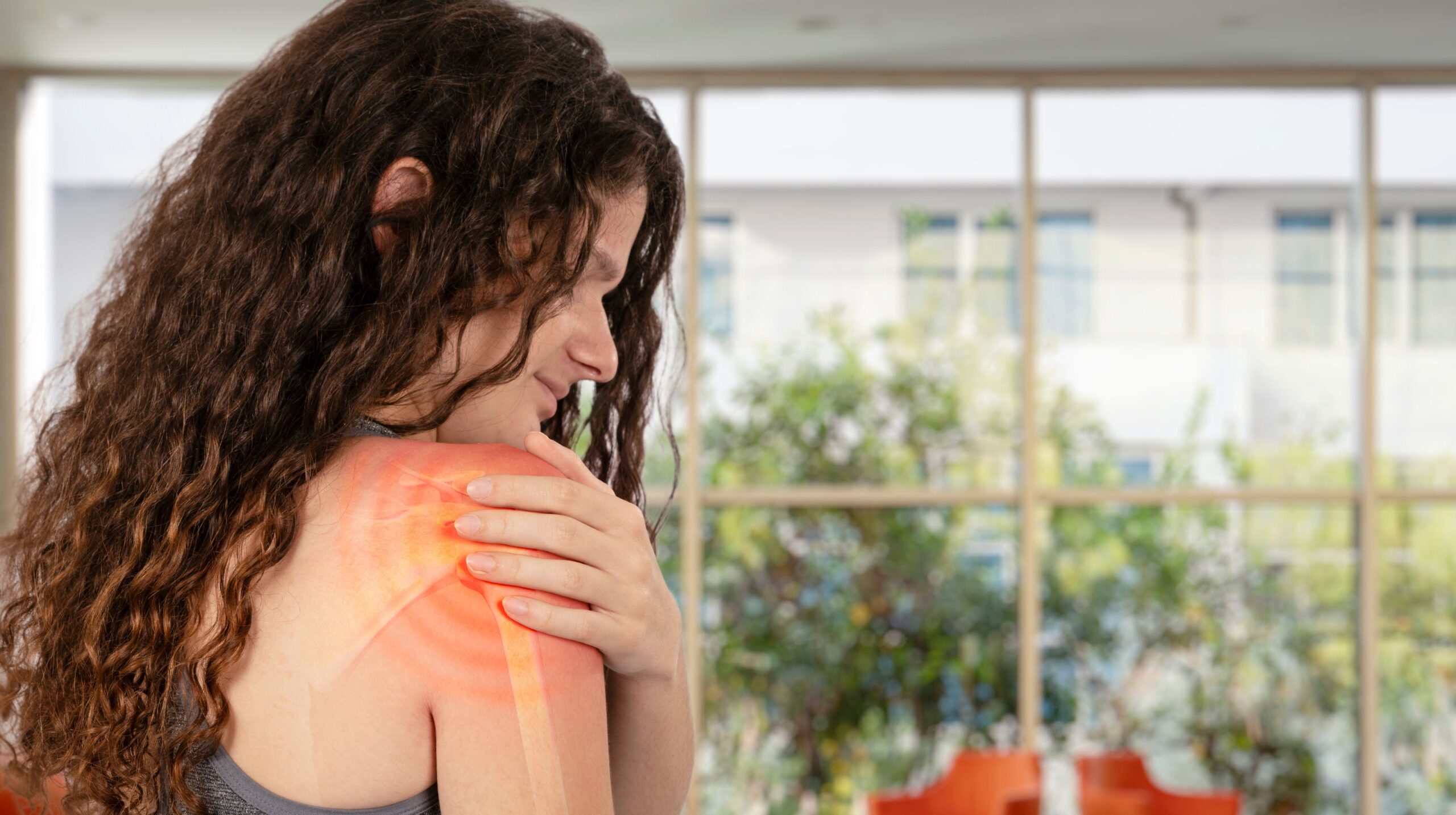 Person receiving chiropractic care for shoulder pain at The Wellness Path in Knoxville TN
