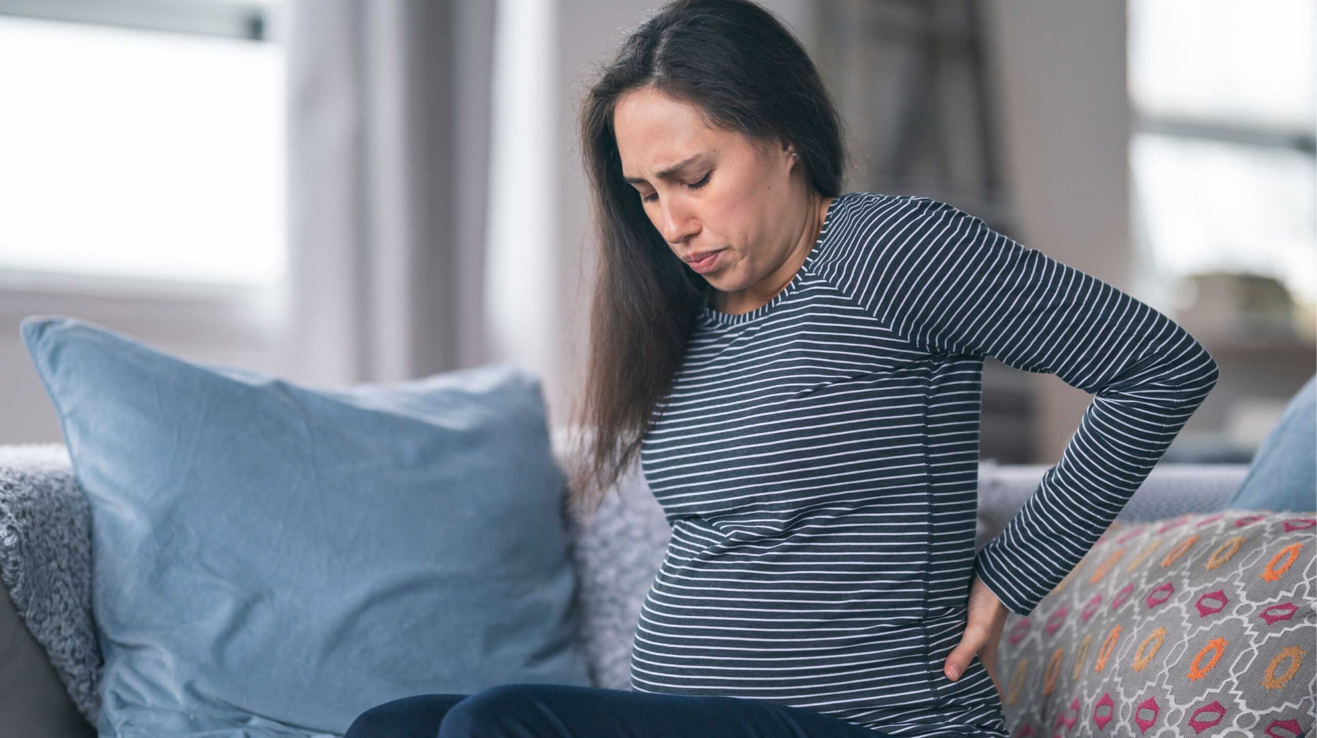 Pregnant woman receiving Webster Technique chiropractic care for SPD at The Wellness Path in Knoxville TN